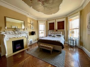 Photo of bed and fireplace in Cherub Room